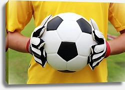 Постер Футболист в желтой футболке с мячом