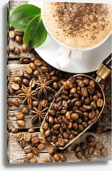 Постер Чашка кофе с жареными кофейными зёрнами на деревянных досках