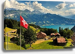 Постер Швейцария. View of Interlaken with Swiss flag