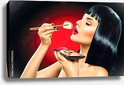 Постер Девушка ест суши