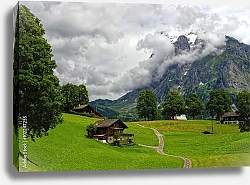 Постер Швейцарский горный пейзаж с традиционными деревянными шале в Гриндельвальде