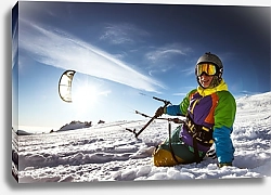Постер Счастливый сноубордист с кайтом лежит в сугробе
