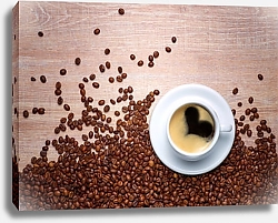Постер Чашка кофе с кофейными зёрнами на деревянном столе