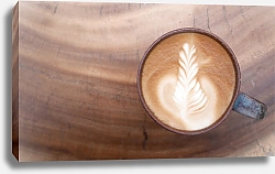 Постер Top view of hot coffee latte art on wooden table
