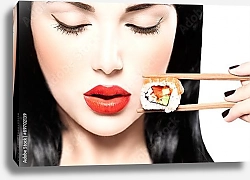 Постер Девушка ест нигири суши палочками для еды