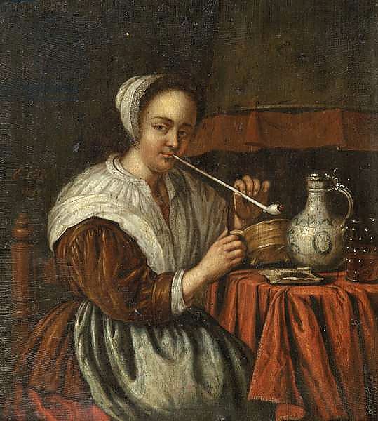 A woman smoking a pipe at a table