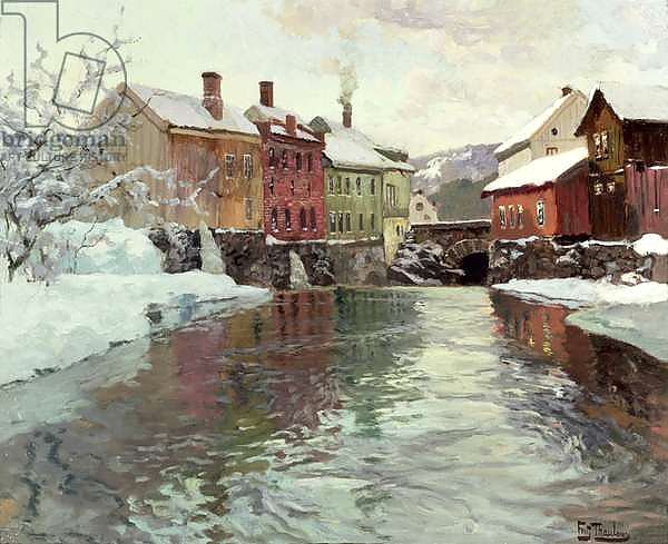 Snow-covered buildings by a river
