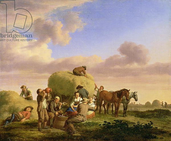 Haymakers resting in a field