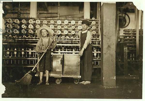 12 year old doffer Ronald Webb and 7 year old Frank Robinson, son of cardroom boss, who sweeps and doffs at Roanoke Cotton Mills, Virginia, 1911