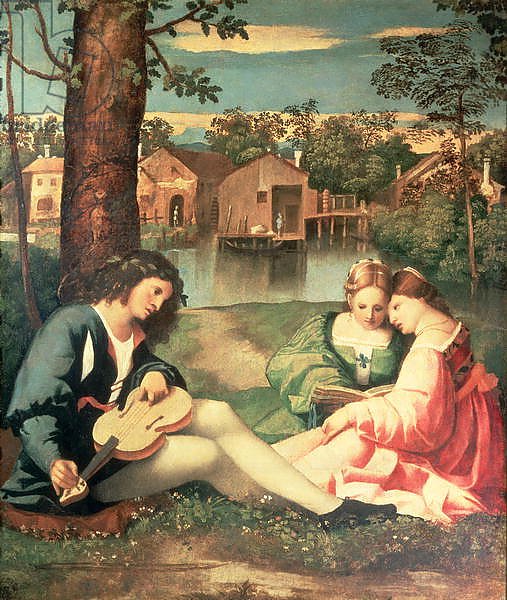 Youth with a guitar and two girls sitting on a river bank