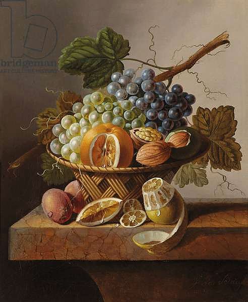 Grapes, an orange and walnuts in a wicker basket with a lemon and plums, all on a marble ledge