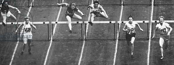 Fanny Blankers-Koen on her way to winning Gold in the 80 m. hurdles race at the 1948 London Olympics
