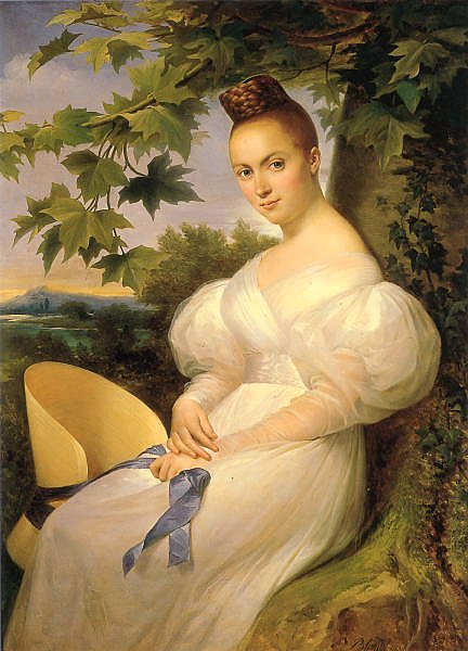 Портрет женщины, сидящей рядом с деревом