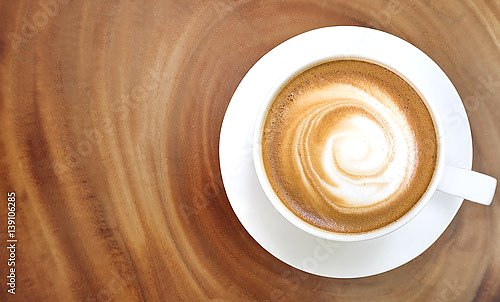 Постер Top view of hot coffee cappuccino on wood table
