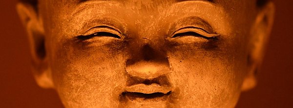 Лицо смеющегося Будды