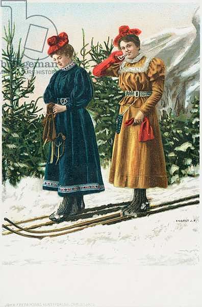 Two women on skis as they ski down a snowy landscape