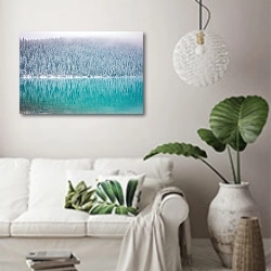 «Зимний лес, отражающийся в голубой воде» в интерьере светлой гостиной в скандинавском стиле над диваном