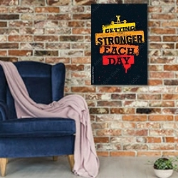 «Getting Stronger Each Day» в интерьере в стиле лофт с кирпичной стеной и синим креслом