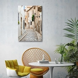 «Испания. Древние улочки города Ситжес » в интерьере современной гостиной с желтым креслом