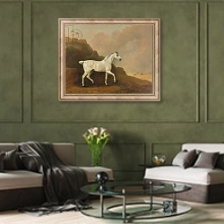«A Grey Arab Stallion in a Desert Landscape» в интерьере гостиной в оливковых тонах