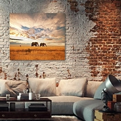 «Два слона на закате идут по полю» в интерьере гостиной в стиле лофт с кирпичной стеной
