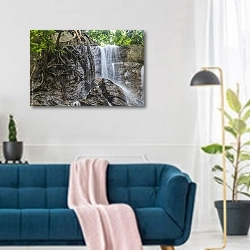 «Водопад в заповеднике Крау в Малайзии» в интерьере современной гостиной над синим диваном