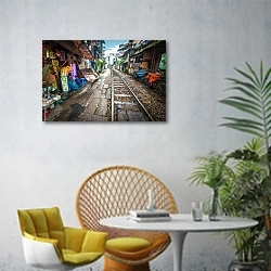 «Железнодорожный переезд на улице в городе, Вьетнам» в интерьере современной гостиной с желтым креслом