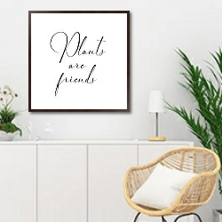 «Plants are friends» в интерьере гостиной в скандинавском стиле над комодом
