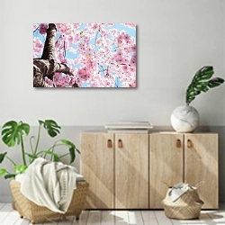 «Дерево цветущей вишни в розовом цвету» в интерьере современной комнаты над комодом