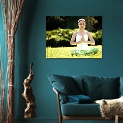 «Медитация в парке» в интерьере зеленой гостиной в этническом стиле над диваном