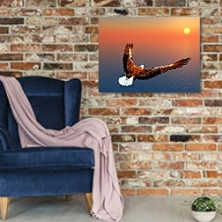 «Орел над морем» в интерьере в стиле лофт с кирпичной стеной и синим креслом