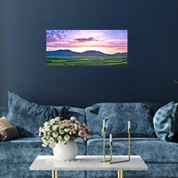 «Горная панорама на закате 2» в интерьере стильной синей гостиной над диваном