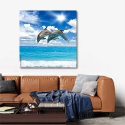 «Три прыгающих дельфина» в интерьере современной гостиной над диваном