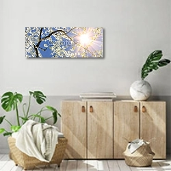 «Весенние ветви под солнцем» в интерьере современной комнаты над комодом