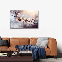 «Ветка вишневого дерева с цветами» в интерьере современной гостиной над диваном