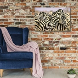 «Стадо зебр» в интерьере в стиле лофт с кирпичной стеной и синим креслом