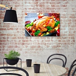 «Жареная индейка, украшенная картофелем, овощами и клюквой» в интерьере современной кухни с кирпичной стеной