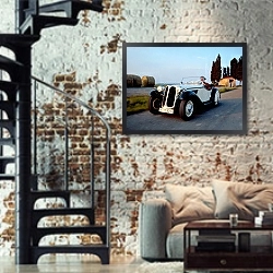 «BMW 315 roadster» в интерьере двухярусной гостиной в стиле лофт с кирпичной стеной