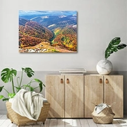 «Яркие деревья в осенних горах» в интерьере современной комнаты над комодом
