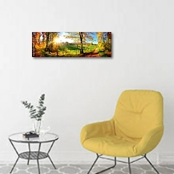 «Чарующая природа осенью: солнечная панорама сельской идиллии» в интерьере светлой комнаты с желтым креслом