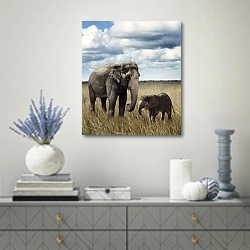 «Слон со слоненком в поле» в интерьере современной гостиной с голубыми деталями
