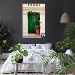 «Зеленая дверь» в интерьере современной спальни с черными стенами
