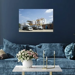 «Нефтехранилище и два грузовика» в интерьере современной гостиной в синем цвете