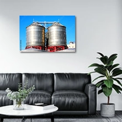 «Промышленные резервуары для хранения нефтепродуктов» в интерьере офиса в зоне отдыха над диваном