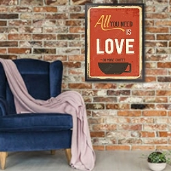 «Все что тебе нужно - это любовь или чашечка кофе» в интерьере в стиле лофт с кирпичной стеной и синим креслом