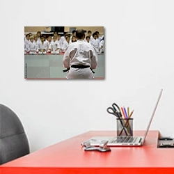 «Школа карате» в интерьере офиса над рабочим местом сотрудника