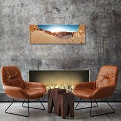 «Панорама с заходящим солнцем в пустыне» в интерьере современной гостиной в стиле лофт над камином