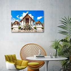 «Таиланд, Бангкок. Храм Ват Сутхат» в интерьере современной гостиной с желтым креслом