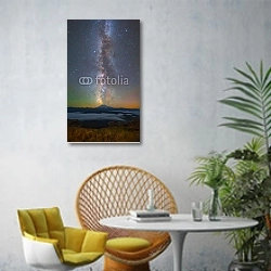 «Россия. Млечный путь над горой Эльбрус №2» в интерьере современной гостиной с желтым креслом