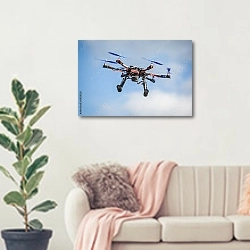 «Беспилотный самолет» в интерьере современной светлой гостиной над диваном